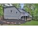 Back of the house with deck, white stair and gray sidings at 9415 Martin Rd, Roswell, GA 30076
