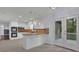 Modern eat-in kitchen with white cabinets, tiled backsplash, and stainless appliances at 9415 Martin Rd, Roswell, GA 30076