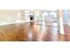 Bright living room featuring hardwood floors and a fireplace with stylish built-in shelving at 9415 Martin Rd, Roswell, GA 30076