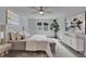 Serene main bedroom with plush bedding, neutral decor and lots of natural light at 9415 Martin Rd, Roswell, GA 30076
