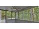 Screened-in porch with ceiling fan and view of backyard at 9415 Martin Rd, Roswell, GA 30076