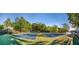 View of tennis courts with lake in background on a bright sunny day at 9415 Martin Rd, Roswell, GA 30076