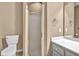 Bathroom featuring a toilet, shower stall, and a vanity with a gray countertop at 2330 Burlington Ln, Snellville, GA 30078