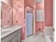 Bathroom featuring a shower and vanity with ample lighting at 2330 Burlington Ln, Snellville, GA 30078