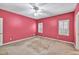 Bedroom with a ceiling fan and two windows for natural light at 2330 Burlington Ln, Snellville, GA 30078
