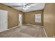 Bedroom with neutral carpet, a ceiling fan and an open closet at 2330 Burlington Ln, Snellville, GA 30078