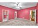 Bedroom with doorway to another room and a door to a mirror closet at 2330 Burlington Ln, Snellville, GA 30078
