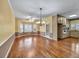 Bright dining area with hardwood floors, chandelier, and bay window at 2330 Burlington Ln, Snellville, GA 30078