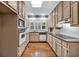 Efficient kitchen with stainless steel appliances and ample cabinet space at 2330 Burlington Ln, Snellville, GA 30078