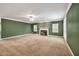 Spacious living room with fireplace, large windows, and neutral carpeting at 2330 Burlington Ln, Snellville, GA 30078