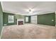 An angle of a living room with a fireplace, and shutters on the windows at 2330 Burlington Ln, Snellville, GA 30078