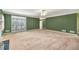Large living room with a fireplace, windows, and carpet at 2330 Burlington Ln, Snellville, GA 30078