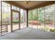 View of a screened porch with a view of the backyard landscaping at 2330 Burlington Ln, Snellville, GA 30078