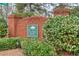 Stockton Walk neighborhood brick sign surrounded by blooming bushes at 2330 Burlington Ln, Snellville, GA 30078