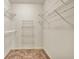 Walk-in closet with wire shelving and neutral carpeting at 2330 Burlington Ln, Snellville, GA 30078