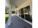 Covered porch with columns and ceiling fans overlooks the backyard and multiple glass doors at 4824 Highway 20 Se, Conyers, GA 30013
