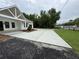 Long concrete driveway leading to a charming one-story house, offering ample parking space at 4824 Highway 20 Se, Conyers, GA 30013
