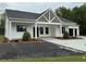 Beautiful one-story home with white siding, black trim, and well-manicured landscaping at 4824 Highway 20 Se, Conyers, GA 30013