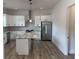Kitchen with white cabinets, stainless appliances, and granite countertops at 4824 Highway 20 Se, Conyers, GA 30013