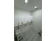 Laundry room with white cabinets and light tile flooring at 4824 Highway 20 Se, Conyers, GA 30013