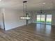 Living area with wood floors and sliding glass doors at 4824 Highway 20 Se, Conyers, GA 30013
