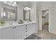 Bathroom features double sinks, granite countertops, and wood-look tile flooring at 5450 Piney Grove Dr, Cumming, GA 30040