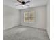 Neutral bedroom with carpet, ceiling fan and natural light at 5450 Piney Grove Dr, Cumming, GA 30040