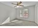 Cozy bedroom with large window offering abundant natural light at 5450 Piney Grove Dr, Cumming, GA 30040
