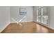 Bedroom showcasing hardwood floors, and large window offering natural light at 5450 Piney Grove Dr, Cumming, GA 30040