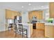 Kitchen featuring wood cabinets, stainless steel appliances, and a center island with bar seating at 5450 Piney Grove Dr, Cumming, GA 30040