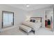 Serene bedroom with a large mirror, neutral tones, and a comfortable queen-sized bed at 756 Stickley Oak Way, Woodstock, GA 30189