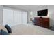 Relaxing bedroom with a large window, stylish furniture, and soft carpeting at 756 Stickley Oak Way, Woodstock, GA 30189