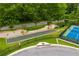 Community bocce ball and tennis courts, surrounded by lush greenery and well-manicured landscapes at 756 Stickley Oak Way, Woodstock, GA 30189
