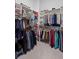 Spacious walk-in closet with ample shelving and hanging space for organization at 756 Stickley Oak Way, Woodstock, GA 30189