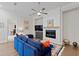 Bright living room featuring a cozy fireplace, comfortable seating, and hardwood floors at 756 Stickley Oak Way, Woodstock, GA 30189