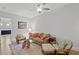 Cozy living room with stylish furniture, a ceiling fan, hardwood floors, and a decorative rug at 756 Stickley Oak Way, Woodstock, GA 30189