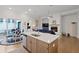Open floor plan of the kitchen and dining area with hardwood flooring and access to the patio at 756 Stickley Oak Way, Woodstock, GA 30189