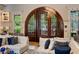Comfortable lounge area featuring a striking arched doorway and stylish decor at 756 Stickley Oak Way, Woodstock, GA 30189