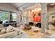 Elegant lounge featuring stylish seating, statement art, and versatile entertaining space at 756 Stickley Oak Way, Woodstock, GA 30189
