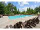 Inviting community pool with ample seating and well-maintained grounds for relaxation at 756 Stickley Oak Way, Woodstock, GA 30189