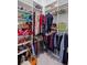 Organized walk-in closet featuring shelving, rods, and ample storage space for clothes and accessories at 756 Stickley Oak Way, Woodstock, GA 30189