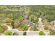 A stately brick and stone home nestled among the trees in a quiet neighborhood at 800 Flathead Pass, Suwanee, GA 30024