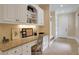 Functional home office with built-in cabinets, granite countertops, and ample storage space at 800 Flathead Pass, Suwanee, GA 30024