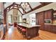 Open kitchen with granite countertops, large island, and stainless steel appliances overlooking a living area at 800 Flathead Pass, Suwanee, GA 30024