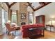 Inviting living room with a stone fireplace, vaulted ceilings, hardwood floors, and natural light at 800 Flathead Pass, Suwanee, GA 30024