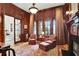 Cozy living room with hardwood floors, fireplace, built-in shelving, and abundant natural light at 800 Flathead Pass, Suwanee, GA 30024