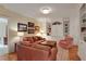 Living room featuring a leather sofa, built-in cabinets, and neutral colors at 800 Flathead Pass, Suwanee, GA 30024