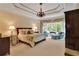 Spacious main bedroom features a tray ceiling, chandelier, and a bay window with seating area at 800 Flathead Pass, Suwanee, GA 30024