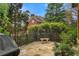 Stone patio with iron railing, bench seating, and lush greenery offers outdoor relaxation at 800 Flathead Pass, Suwanee, GA 30024
