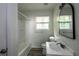 Functional bathroom featuring a tub, shower, toilet, sink, and storage at 4704 Apache Sw Trl, Atlanta, GA 30331